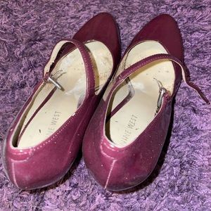 Worn cranberry Mary Jane heels